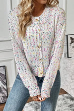 Pastel speckled and floral print button-front cardigan sweater with round neckline