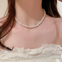 White pearl choker with floral design on titanium steel rice bead chain