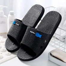 Gray open toe flats with blue fish design on fabric and black sole