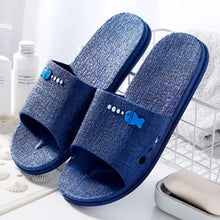 Blue open toe flats with fish design and textured sole