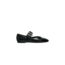 Black patent leather Mary Jane round toe flats with silver buckles