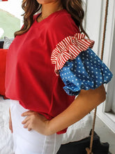 Patriotic short sleeve red top with ruffled red and white striped sleeves and blue fabric with white stars round neck