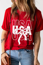 Patriotic USA bow graphic on red short-sleeved T-shirt