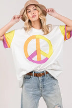White oversized peace applique t-shirt with fig color block graphic
