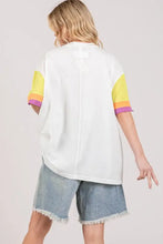 Peace applique t-shirt with fig color block, striped sleeves, and denim shorts