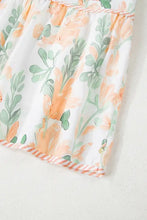 Peach and green floral ruffled romper on white background
