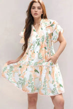 Peach and green floral ruffled romper with scalloped hem