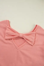 Peach long sleeve sweatshirt with pink bow round neck and back cutout
