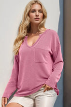 Peach ribbed long sleeve knit top with v-neck and pocket detail