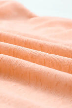 Peach sheer sleeve cover with short sleeve length and textured sheen