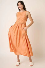 Peach sleeveless midi dress with orange fabric and ruched detail