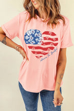 Peach T-Shirt with Heart-Shaped American Flag Design and Blue Jeans