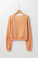 Peach V neck long sleeve waffle knit top with raglan sleeves