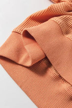 Orange ribbed v-neck long sleeve waffle knit top, slightly stretchy basic style