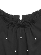 Pearl detail ruffled cap sleeve jumpsuit with black blouse and white embellishments