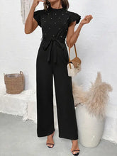Pearl detail ruffled cap sleeve jumpsuit in black with white studs