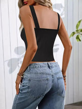 Black ribbed scoop neck tank top with thin straps and square neckline featuring pearl detail