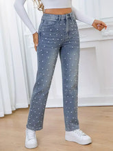 Light-wash denim pearl embellished high waist straight jeans with white polka dots for stylish casual wear