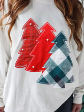 White long-sleeved drop shoulder sweatshirt with pearl-accented plaid christmas tree appliques