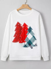 White drop shoulder sweatshirt with three appliquéd christmas trees in red plaid, solid red, and teal herringbone patterns