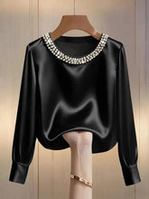 Black satin silk blouse with a pearl trim round neck collar featuring sparkling pearl details