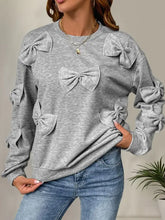Perfee Bow Round Neck Long Sleeve Sweatshirt in grey with fabric bows