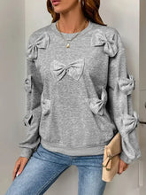 Perfee Bow Round Neck Long Sleeve Sweatshirt in gray with bows