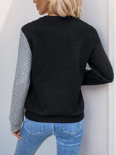 Perfee decorative button contrast long sleeve sweatshirt in black gray quilted design with blue jeans