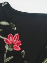 Black perfee embroidered floral bodysuit featuring red and green floral embroidered v neck design