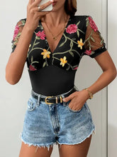 Black sheer mesh sleeved Perfee embroidered floral bodysuit with v neck featuring pink and yellow floral embroidery