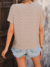 Perfee Eyelet Round Neck Short Sleeve T-Shirt in beige wavy texture with blue denim shorts