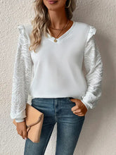 Woman in Perfee Textured long sleeve V-neck top with lace sleeves and jeans