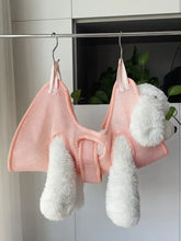 Pink mesh dog grooming hammock harness with fluffy ears and tail for nail trimming