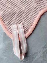 Pink mesh pet grooming hammock blanket with ribbed edge for nail trimming