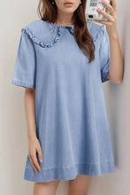 Light blue denim dress with peter pan collar ruffles and short sleeves in a stylish peter pan denim dress design
