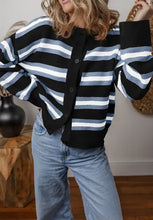 Black and white striped cardigan with bell sleeves and buttons