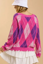Pink and purple argyle pattern v-neck cardigan with white pleated skirt