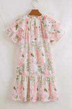 Pink and white floral print romper with ruffled hem and pockets