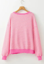 Pink and white striped sweatshirt with sequined heart and frayed hem
