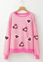 Pink striped heart sequin sweatshirt with long sleeves and ribbed cuffs