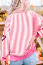 Pink and white striped sweatshirt with glitter and metallic heart accents