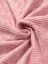 Pink checkered textured round neck top with plush throw blanket