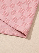 Pink checkered textured round neck top with woven blanket pattern