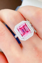 Elegant pink sapphire ring in sterling silver with diamond halo and carat moissanite accents