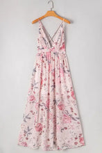 Pink floral halter neck maxi dress with v-neck, tie waist, crisscross back
