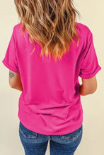 Pink floral print womens t-shirt with hot pink v-neck and rolled sleeves