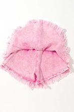 Pink frayed denim shorts with wide smocked waistband and raw hem