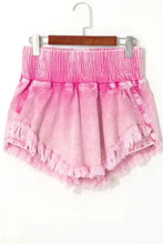 Pink frayed denim shorts with wide smocked waistband and raw hem