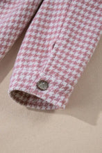 Pink houndstooth button-down shirt with white accents and rolled cuffs
