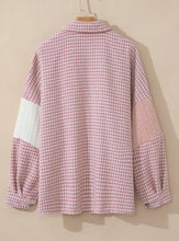 Pink and white houndstooth blouse with balloon sleeves and button closure
